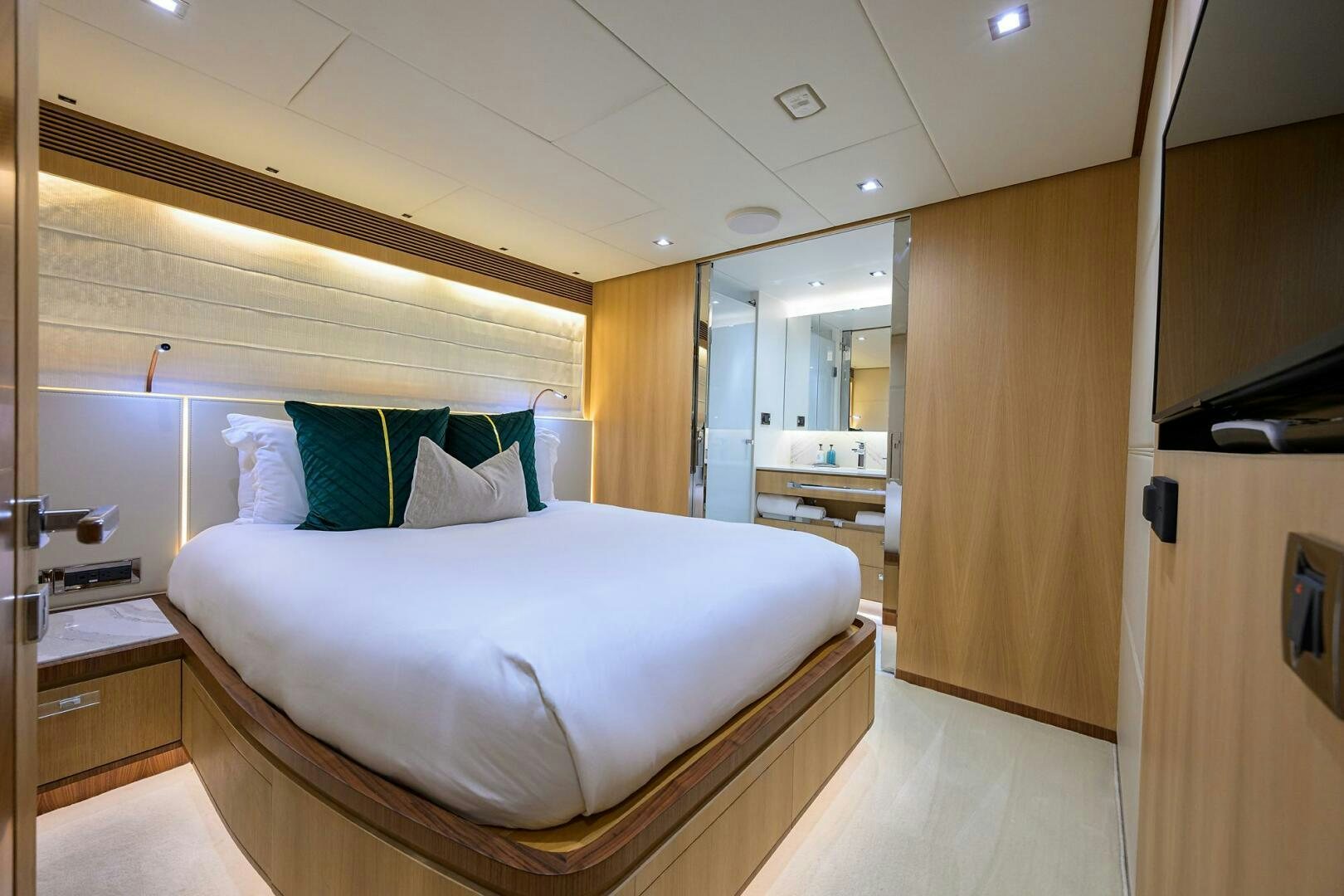 a bedroom with a bed and a desk aboard AQUA LIFE Yacht for Sale
