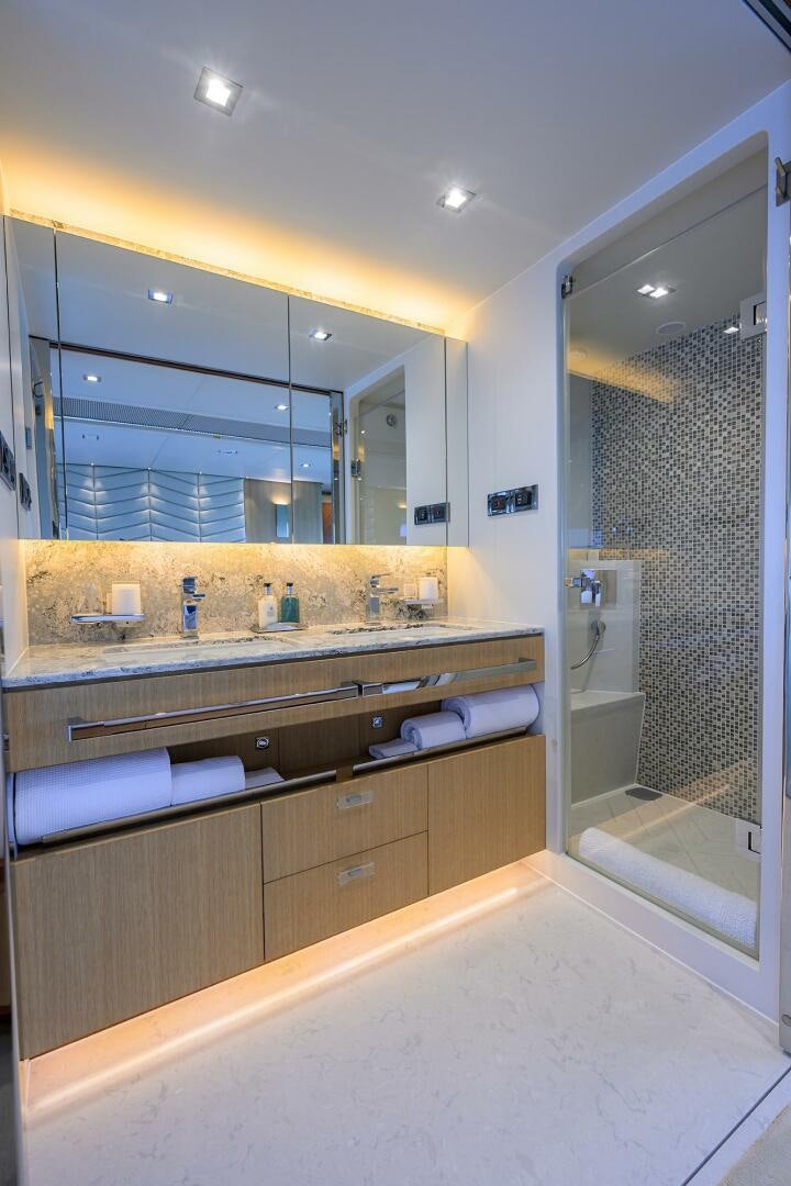 a bathroom with a large mirror aboard AQUA LIFE Yacht for Sale