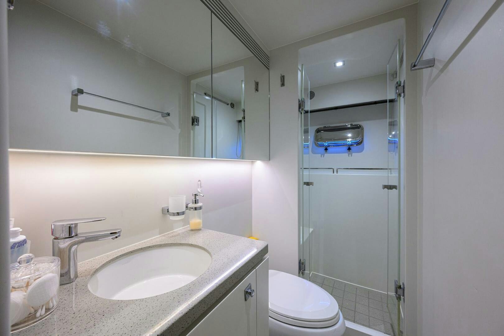a bathroom with a sink and a toilet aboard AQUA LIFE Yacht for Sale