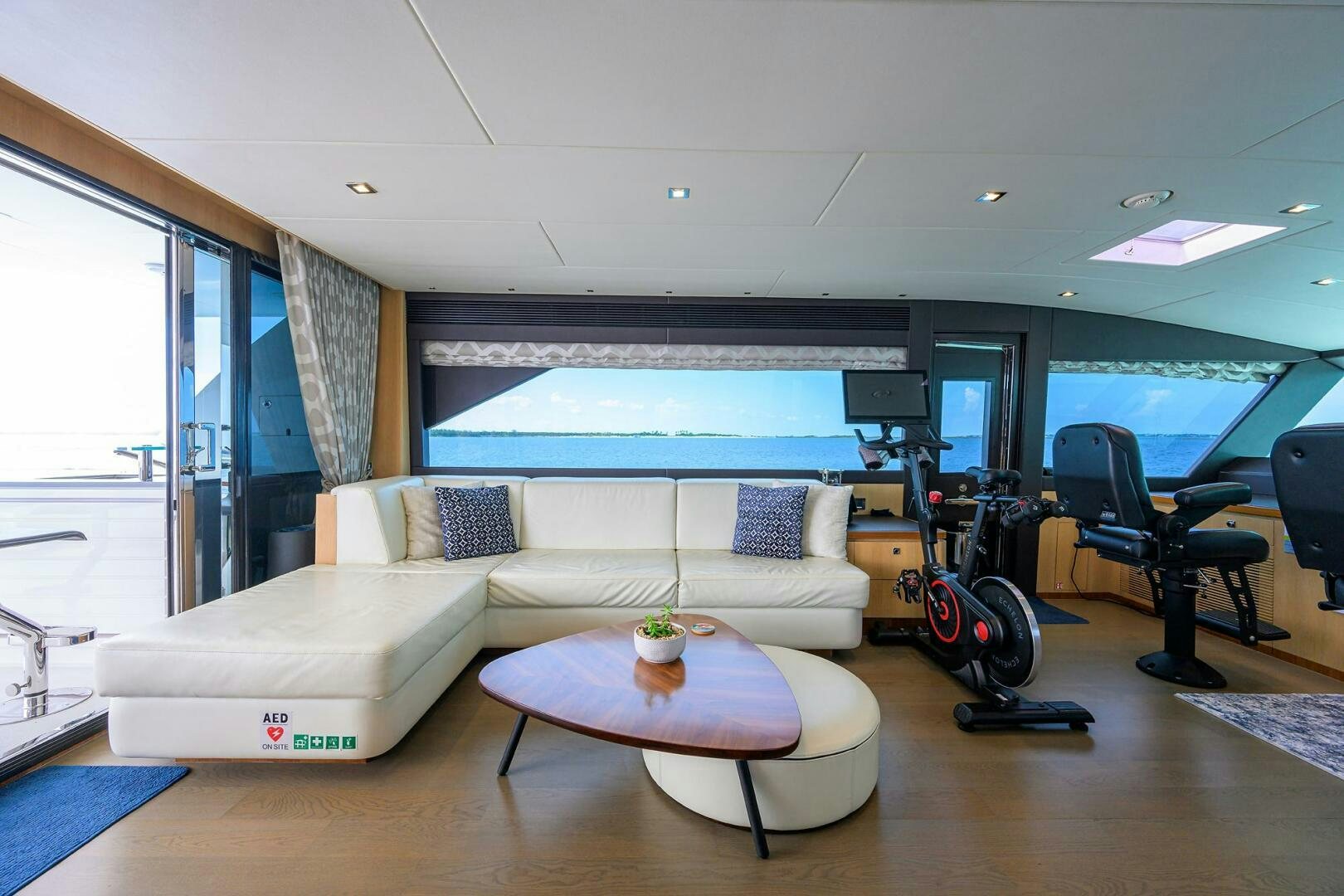 a living room with a couch and a table aboard AQUA LIFE Yacht for Sale
