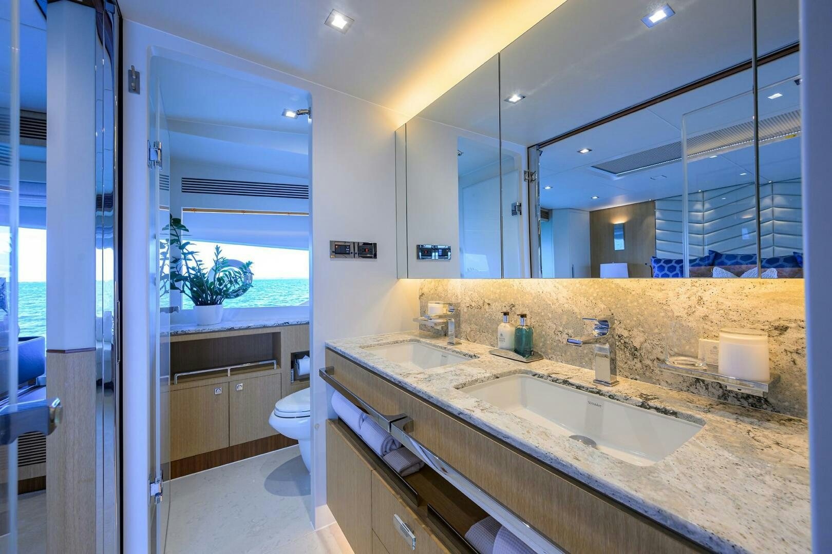 a bathroom with a large mirror aboard AQUA LIFE Yacht for Sale