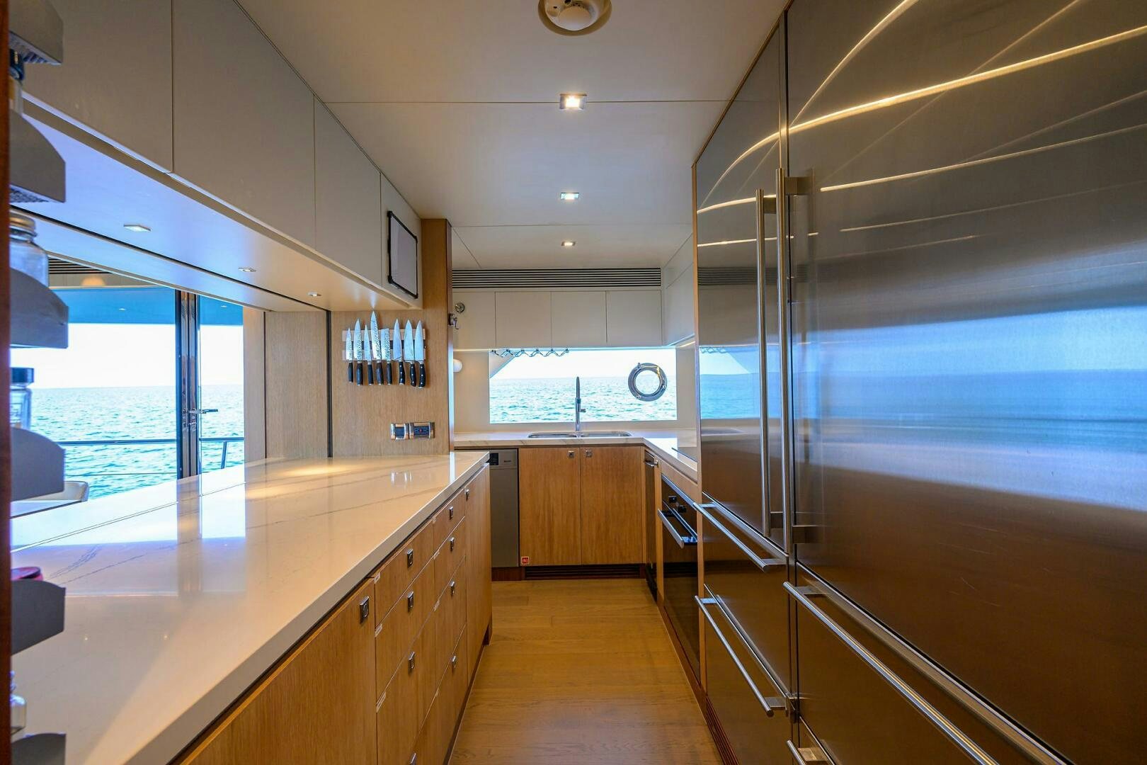 a large kitchen with a large window aboard AQUA LIFE Yacht for Sale