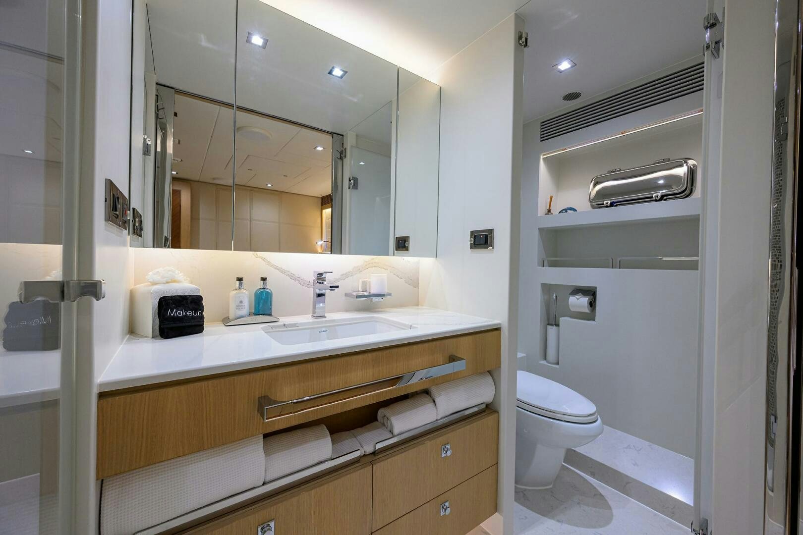 a bathroom with a large mirror aboard AQUA LIFE Yacht for Sale