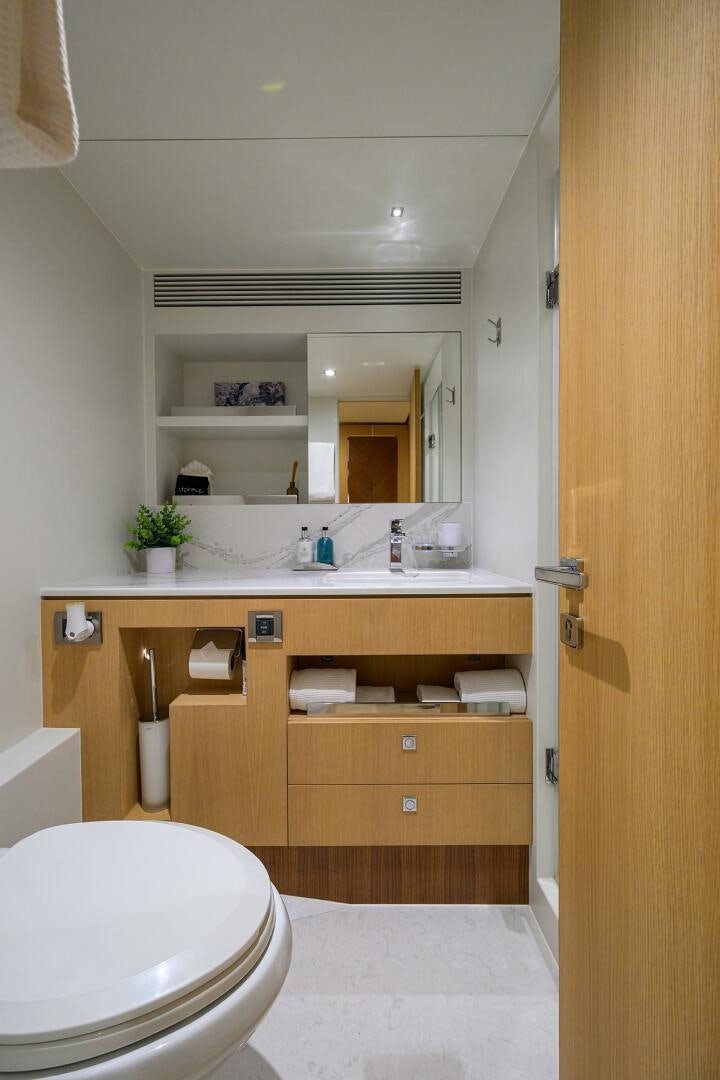 a bathroom with a toilet and a sink aboard AQUA LIFE Yacht for Sale
