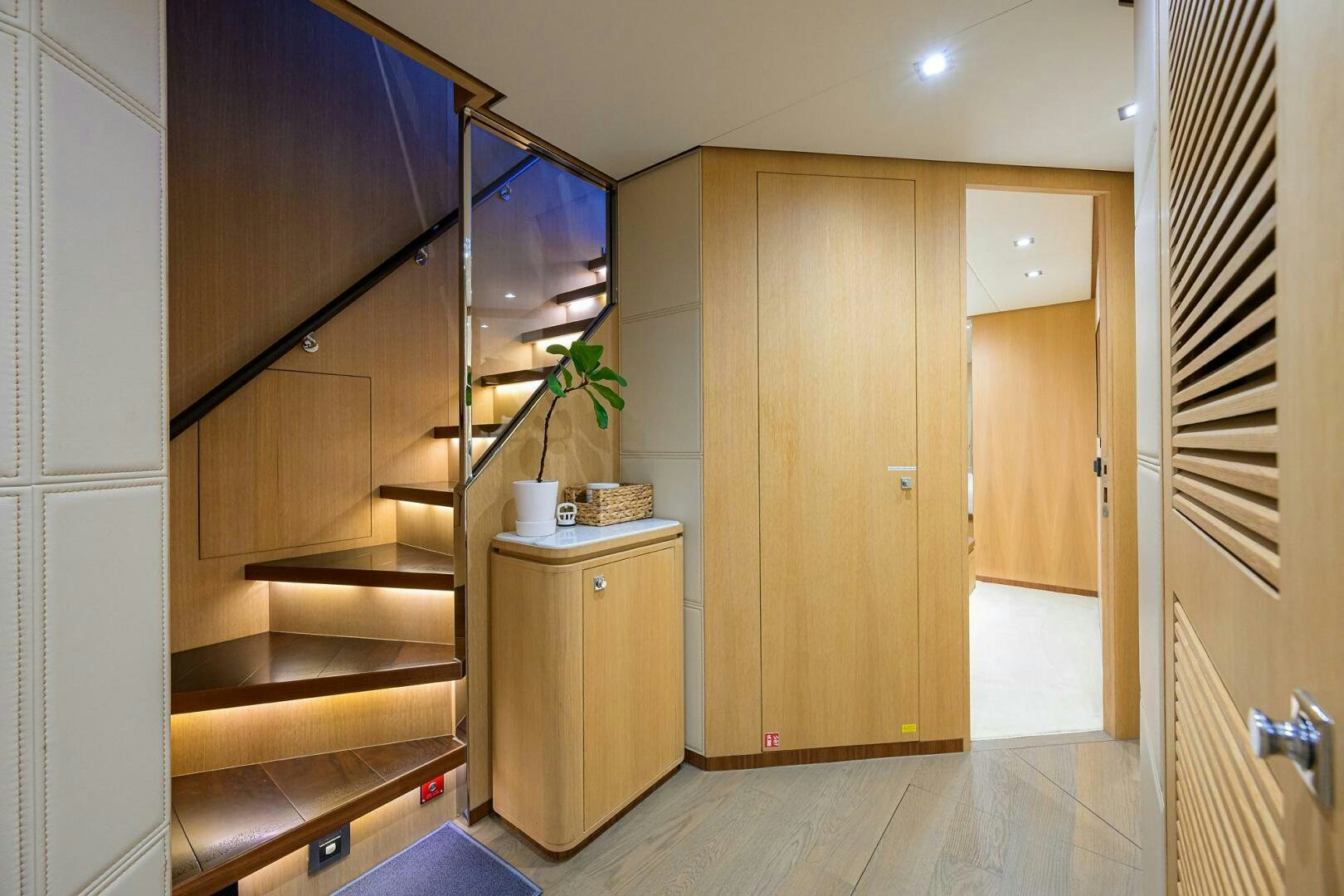 a kitchen with wooden cabinets aboard AQUA LIFE Yacht for Sale