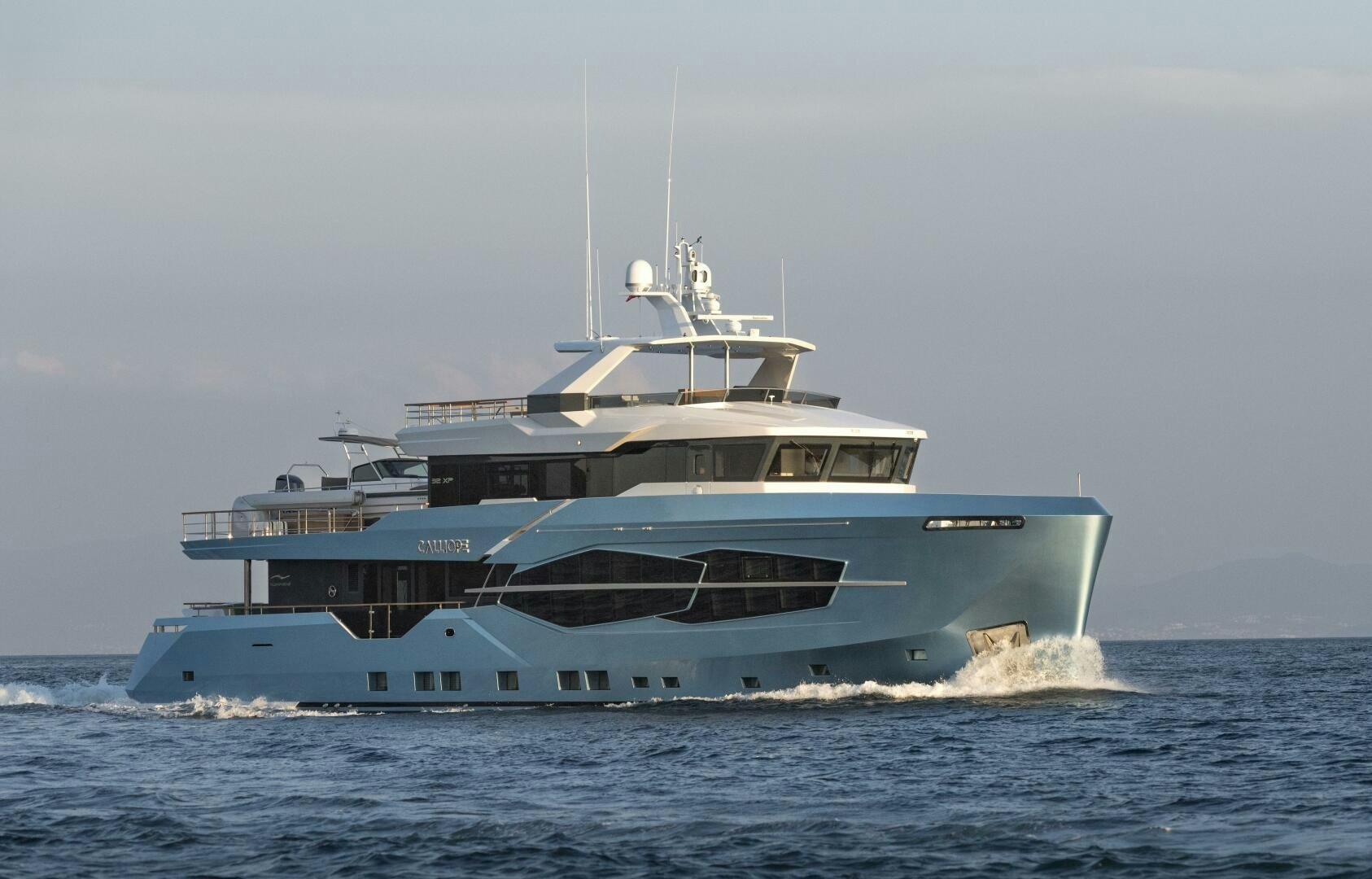 a large boat on the water aboard CALLIOPE Yacht for Sale