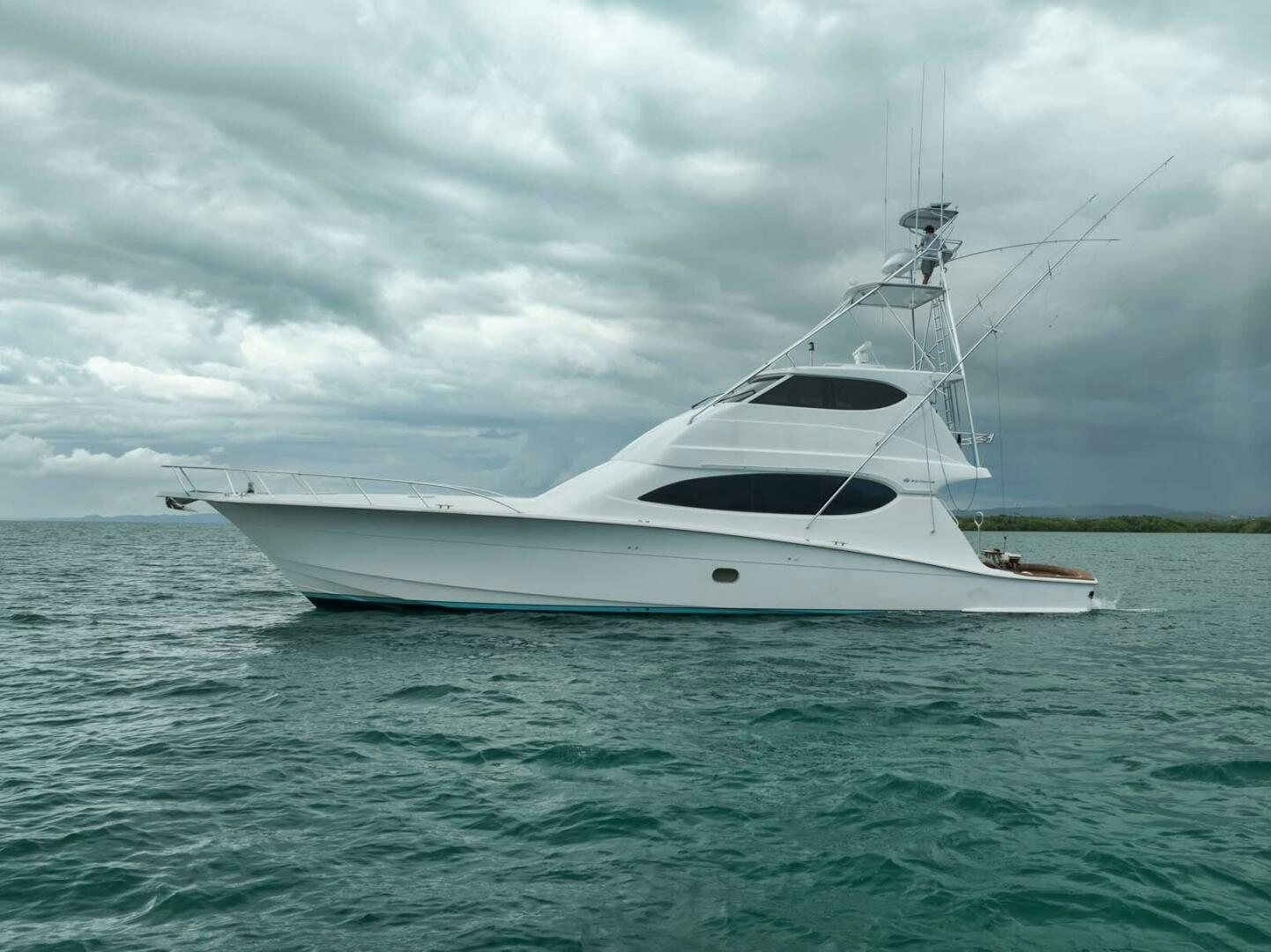 a white boat in the water aboard REEL TRADER Yacht for Sale