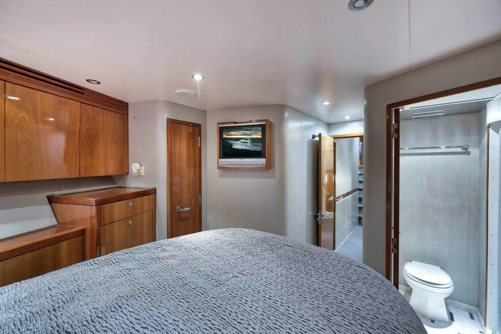 a large bedroom with a large bed aboard REEL TRADER Yacht for Sale