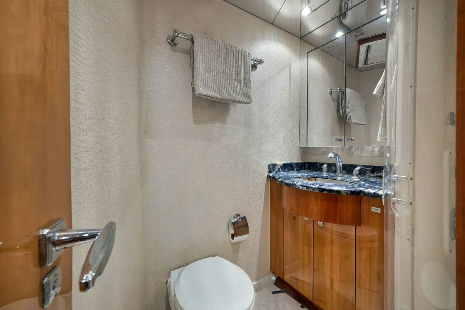 a bathroom with a sink and toilet aboard REEL TRADER Yacht for Sale