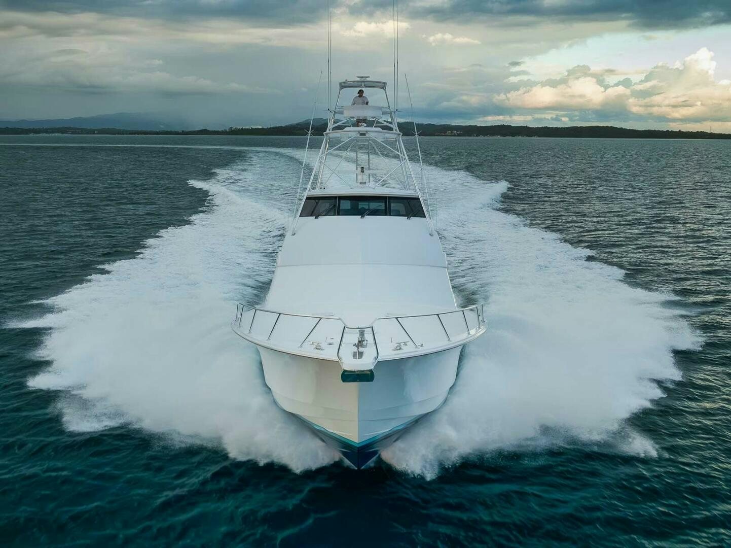 a white boat on water aboard REEL TRADER Yacht for Sale