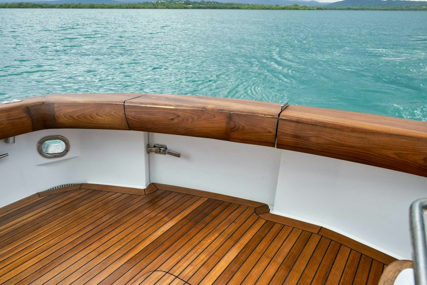 a wooden boat on a body of water aboard REEL TRADER Yacht for Sale