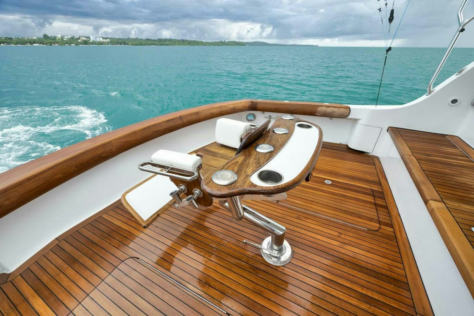 a wooden boat on a body of water aboard REEL TRADER Yacht for Sale