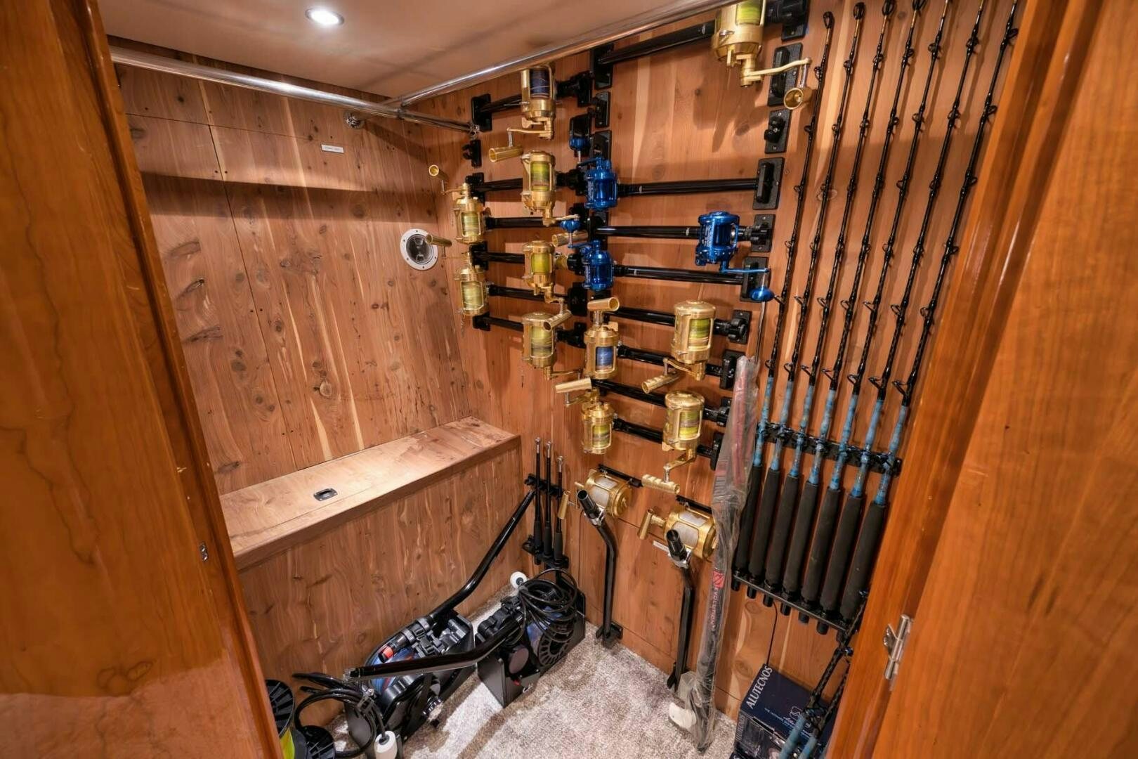 a room with a ladder and a shelf with tools aboard REEL TRADER Yacht for Sale