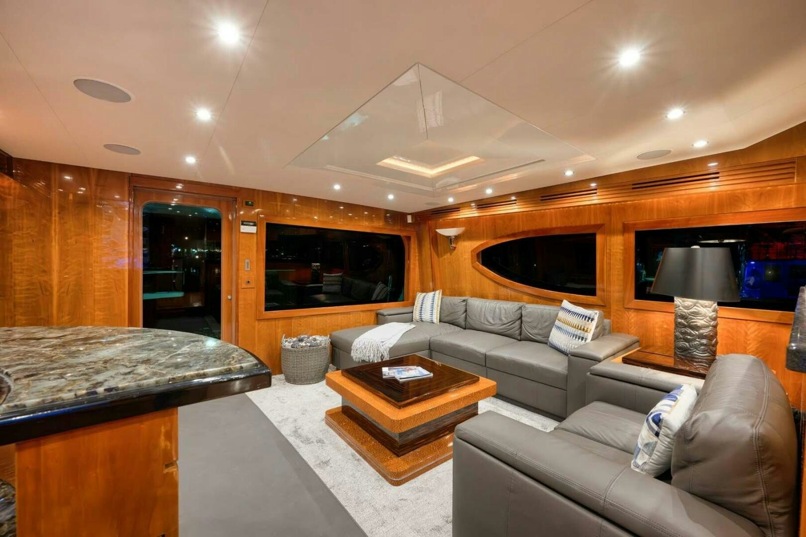 a living room with a bed and a tv aboard REEL TRADER Yacht for Sale