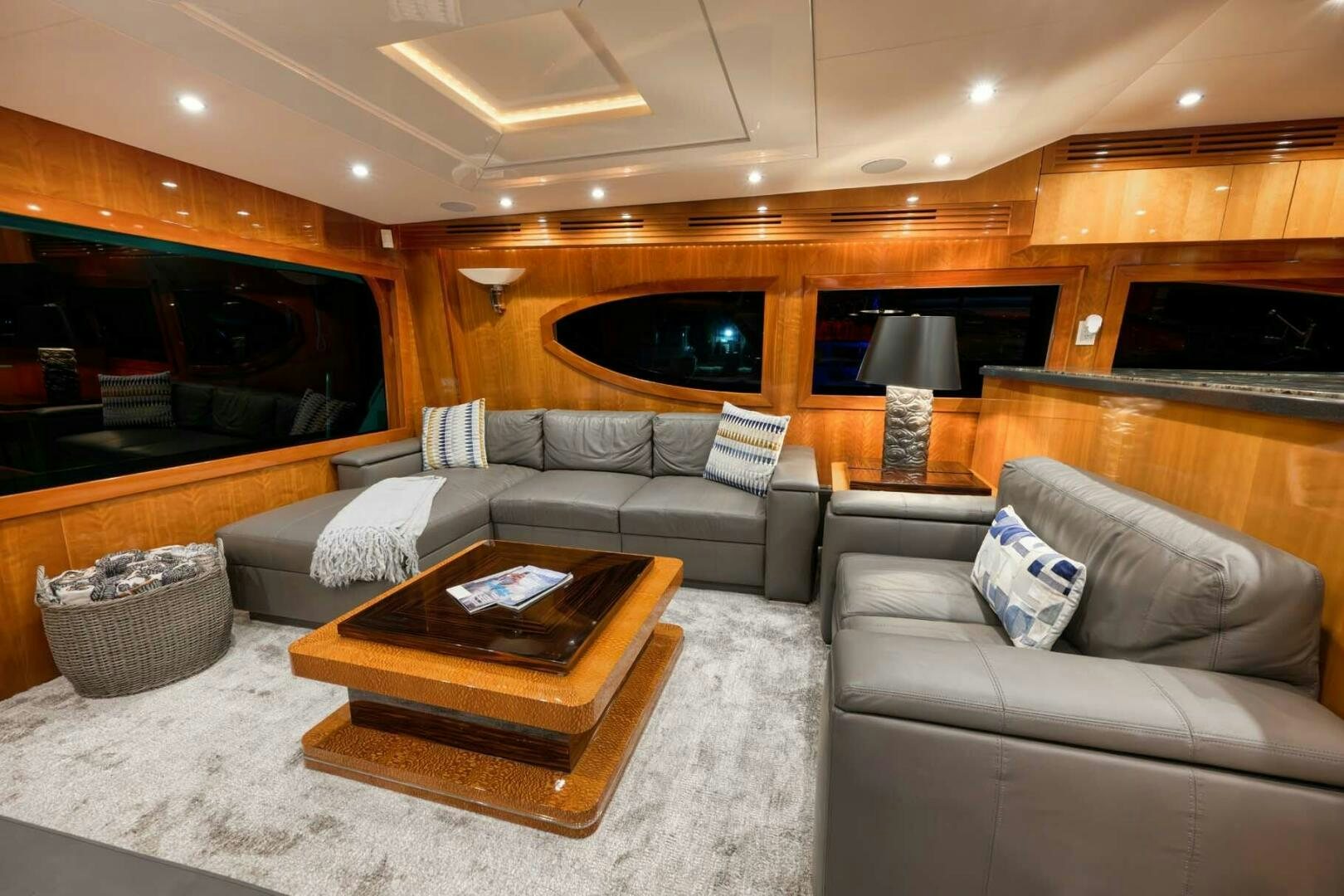 a living room with a couch and a coffee table aboard REEL TRADER Yacht for Sale