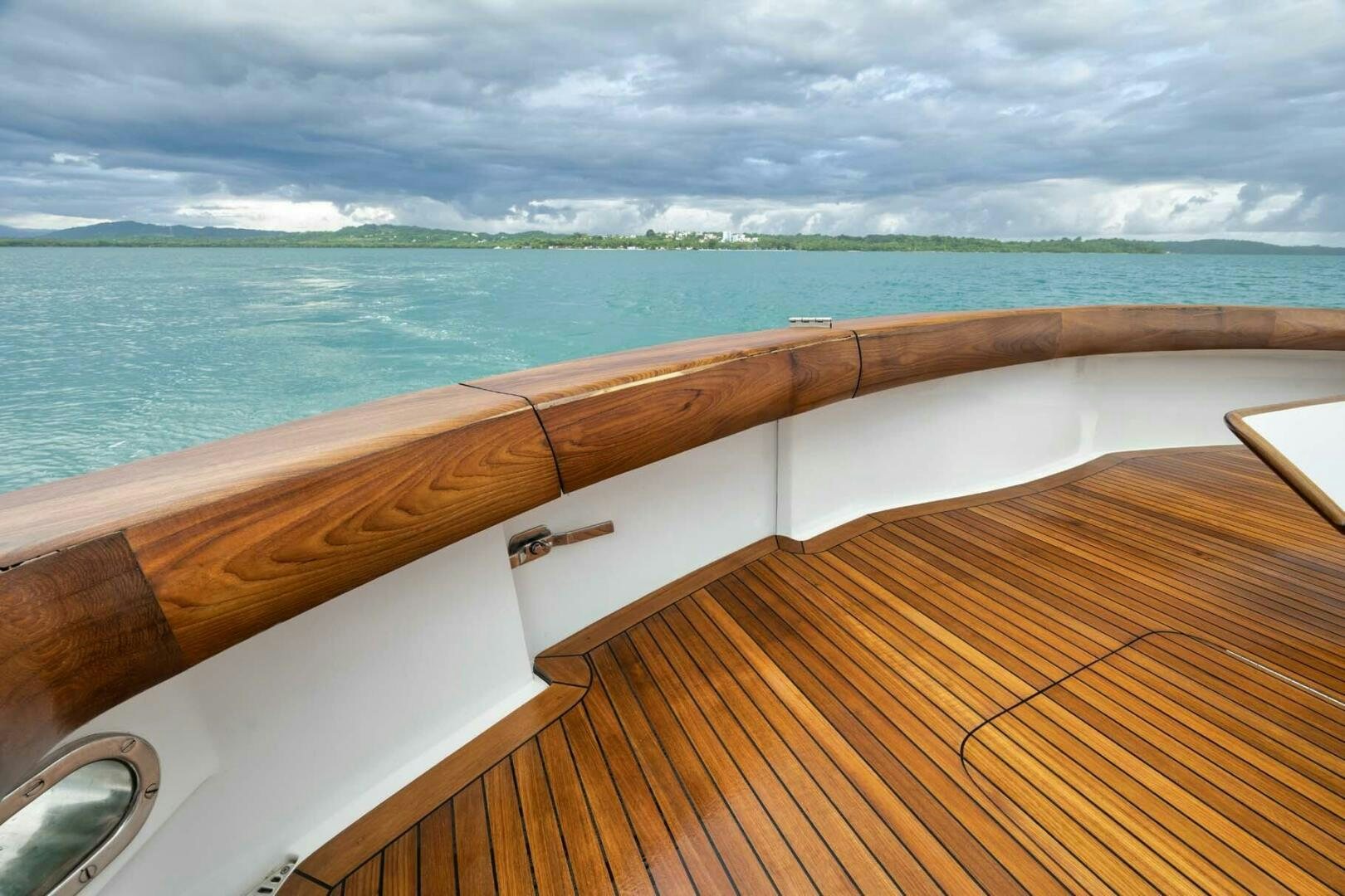 a wooden deck overlooking a body of water aboard REEL TRADER Yacht for Sale