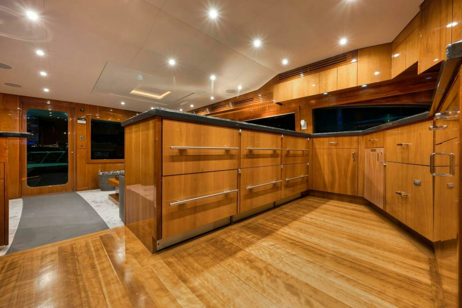 a large wooden room with wooden cabinets aboard REEL TRADER Yacht for Sale