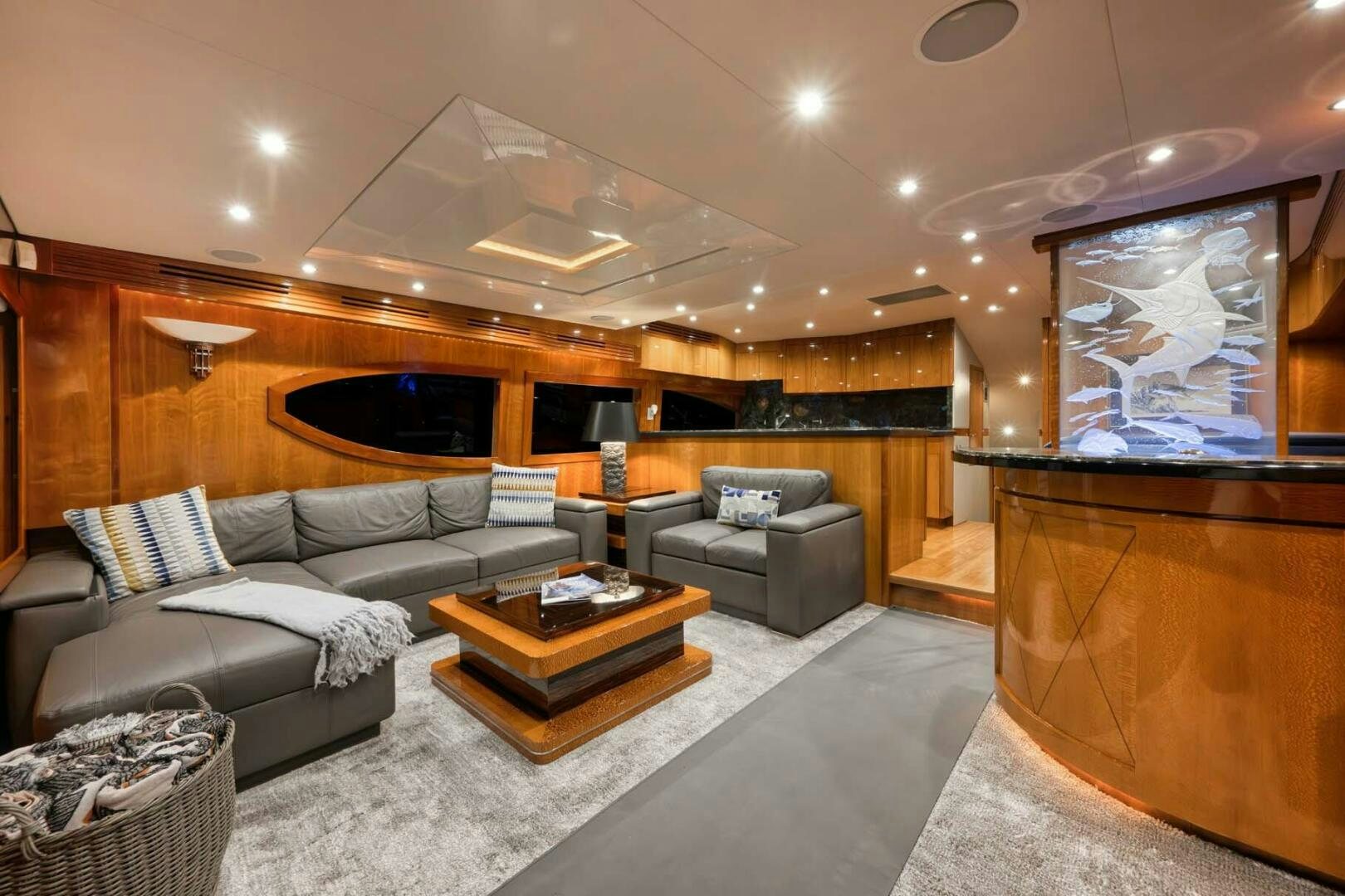 a living room with a fireplace aboard REEL TRADER Yacht for Sale