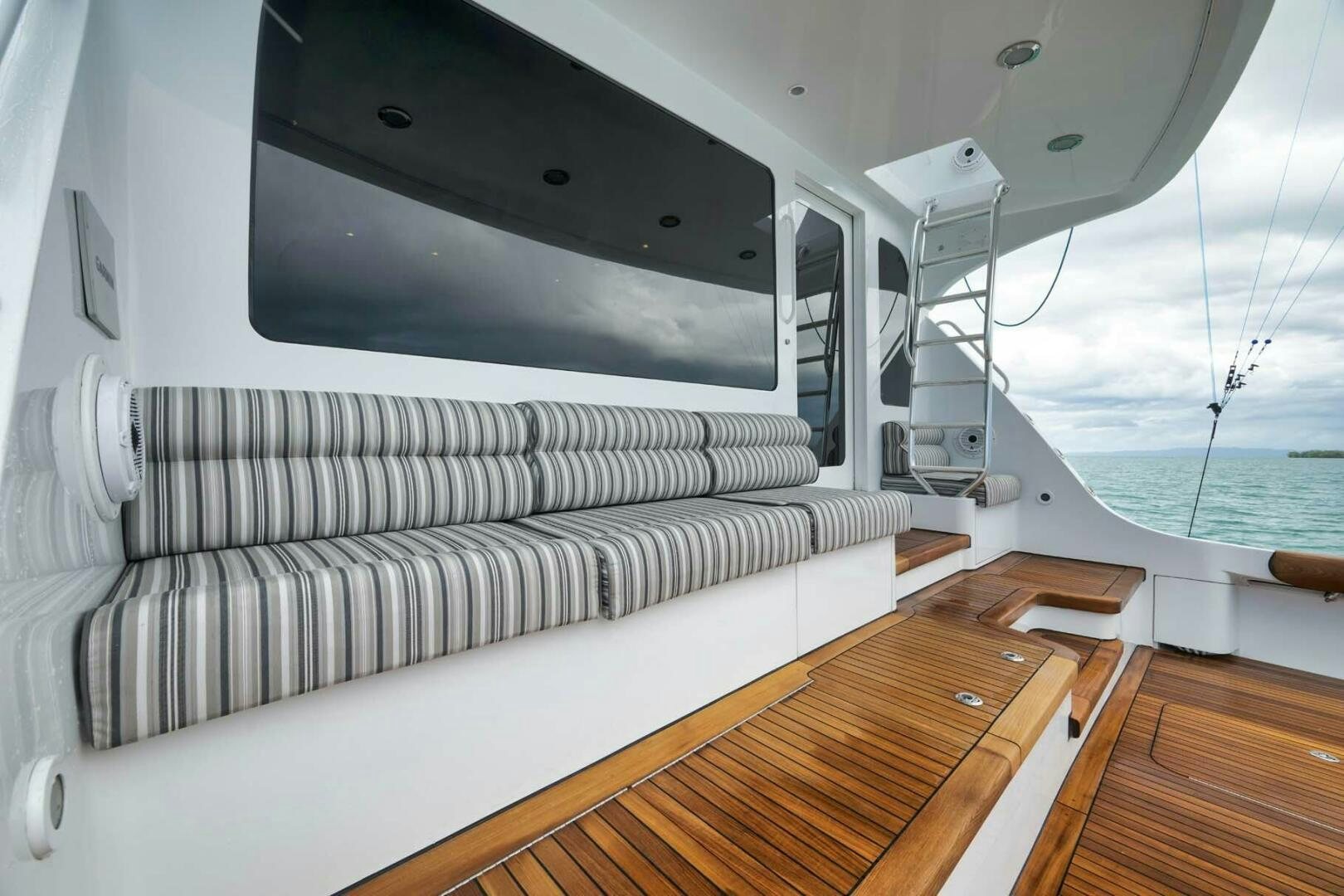 a white couch in a room aboard REEL TRADER Yacht for Sale