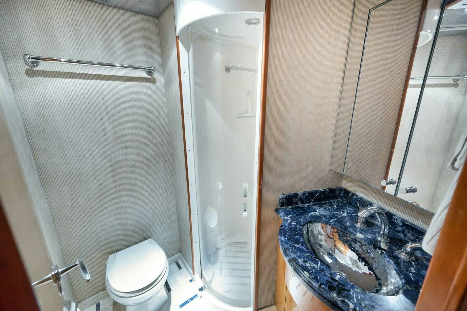 a bathroom with a shower and toilet aboard REEL TRADER Yacht for Sale