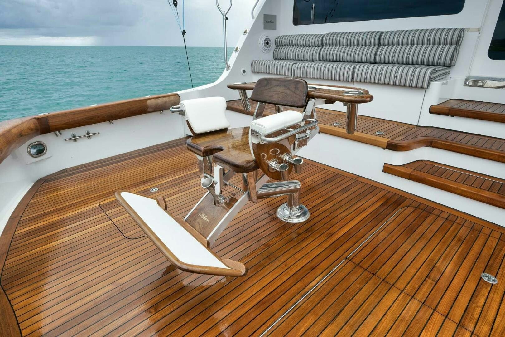 a deck with a deck and chairs on it aboard REEL TRADER Yacht for Sale