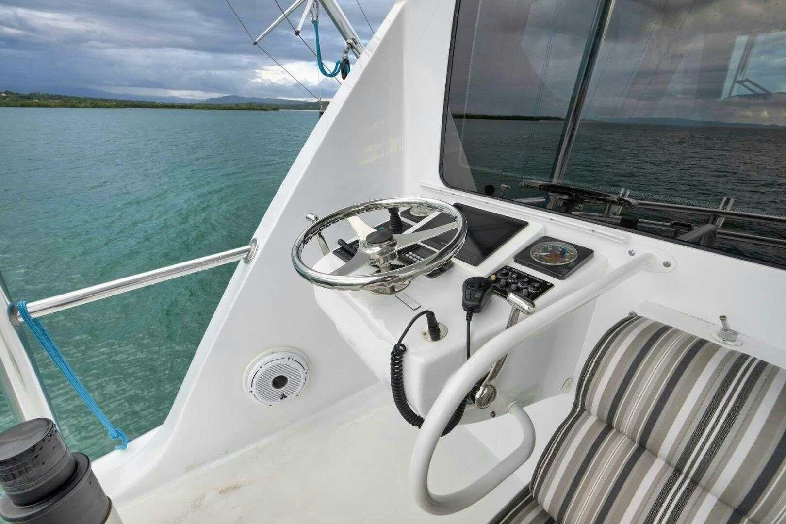 a boat with a steering wheel and a steering wheel aboard REEL TRADER Yacht for Sale