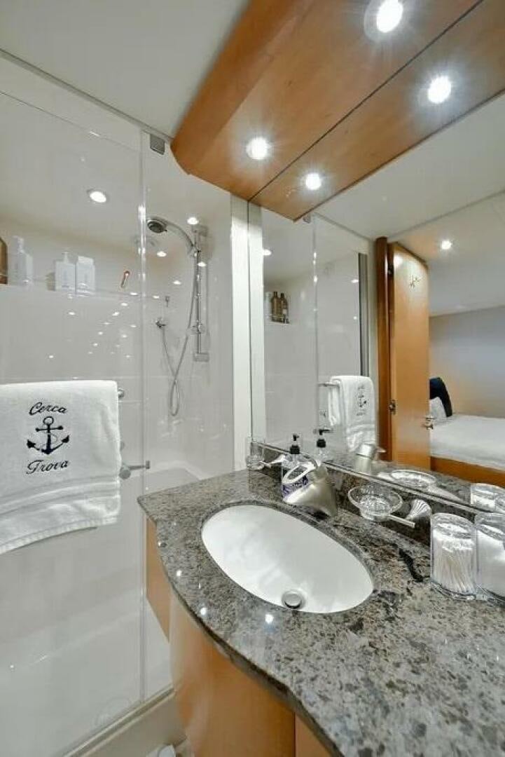 a bathroom with a sink and a shower aboard CERCA TROVA Yacht for Sale