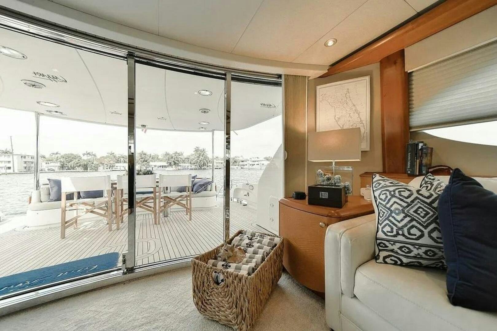 a living room with a large window aboard CERCA TROVA Yacht for Sale