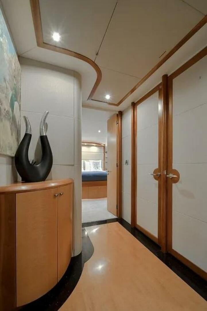 a hallway with a urinal and doors aboard CERCA TROVA Yacht for Sale
