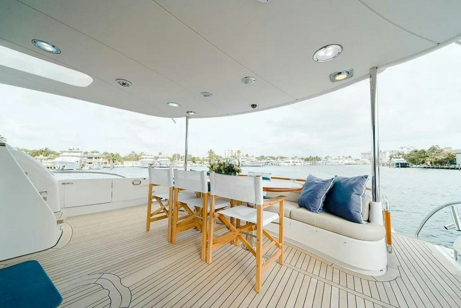 a room with a table and chairs aboard CERCA TROVA Yacht for Sale