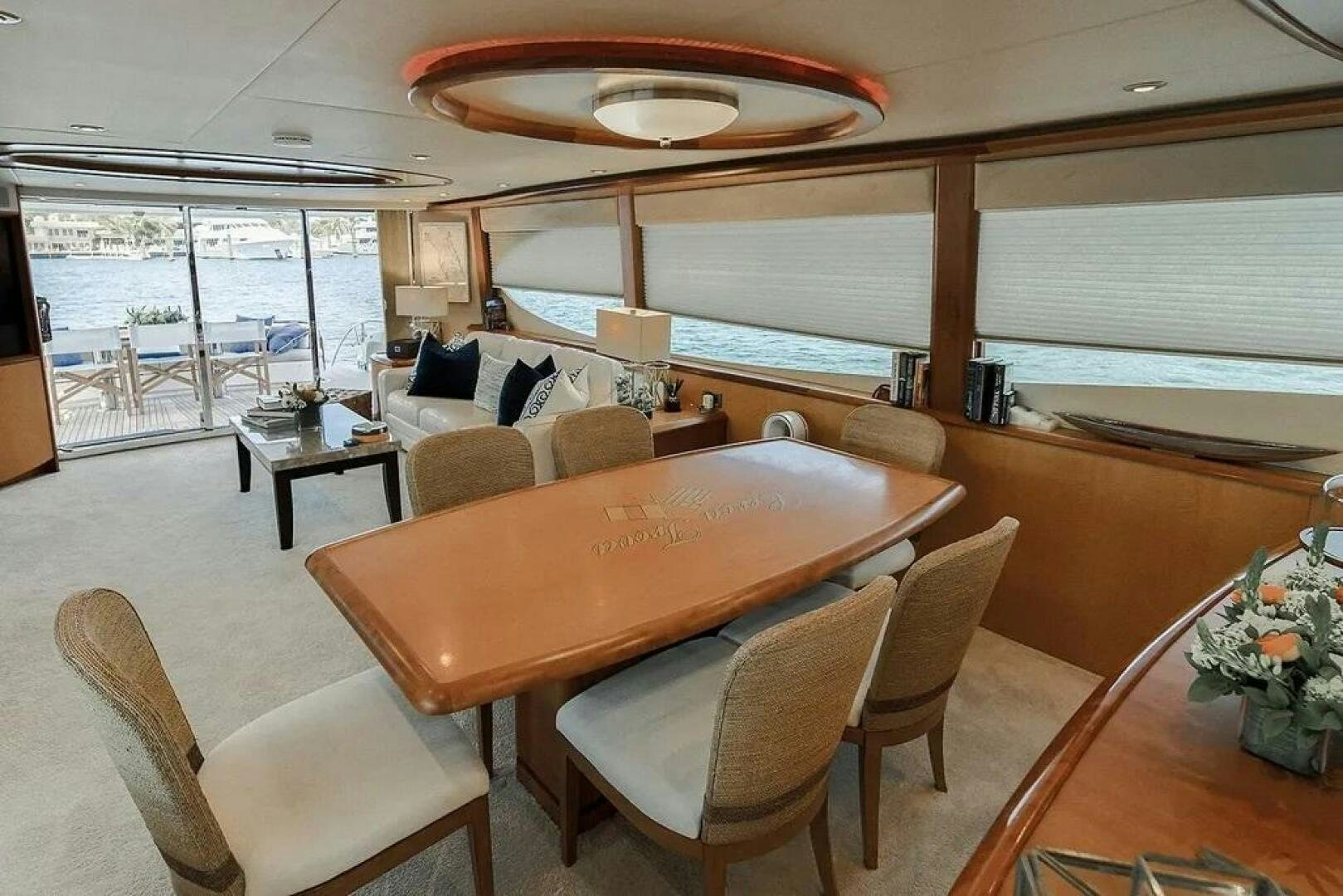 a large living room with a large table and chairs aboard CERCA TROVA Yacht for Sale