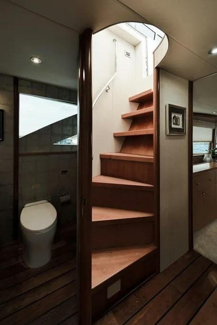 a wooden staircase in a bathroom aboard CERCA TROVA Yacht for Sale