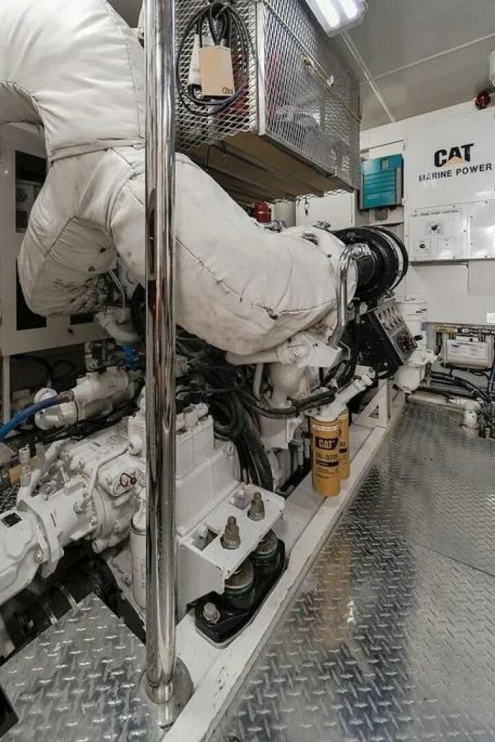 a person in a white coat aboard CERCA TROVA Yacht for Sale