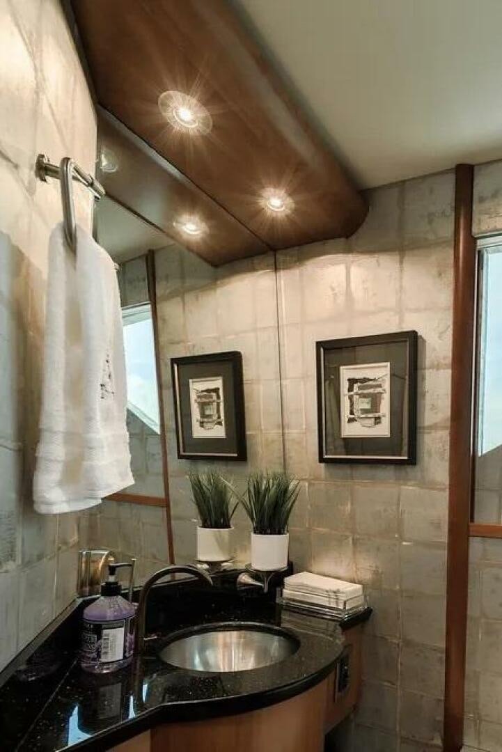 a bathroom with a sink and a mirror aboard CERCA TROVA Yacht for Sale