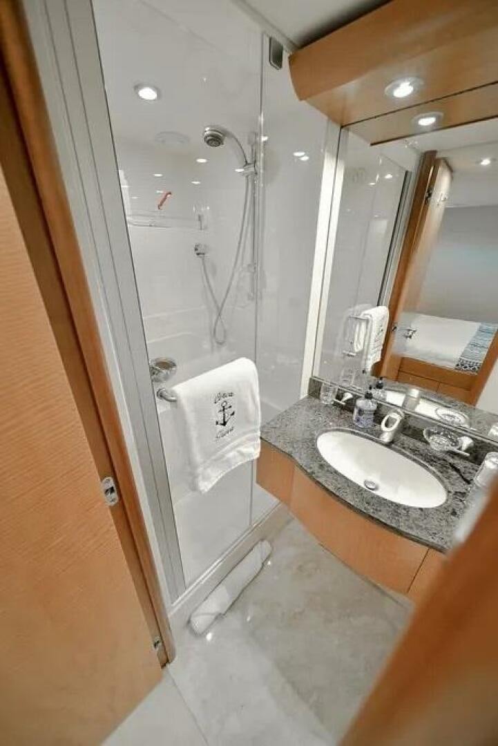 a bathroom with a sink and a shower aboard CERCA TROVA Yacht for Sale