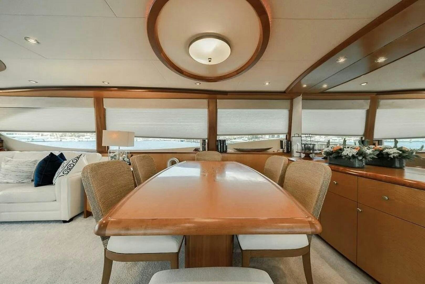 a kitchen with a table and chairs aboard CERCA TROVA Yacht for Sale