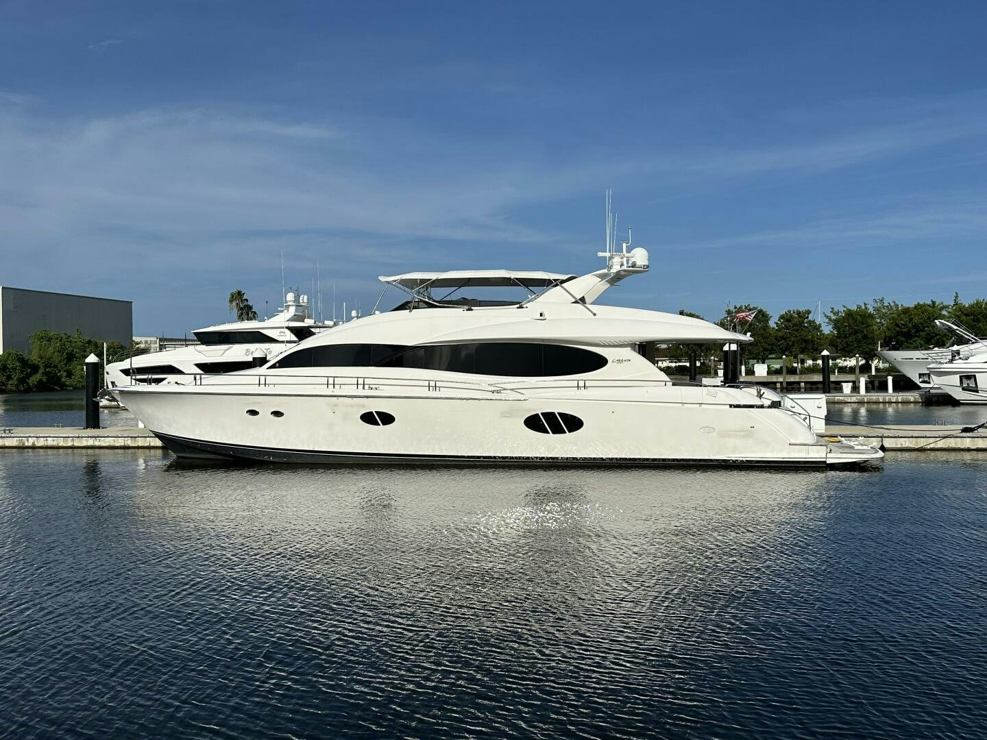 a white yacht in a harbor aboard CERCA TROVA Yacht for Sale
