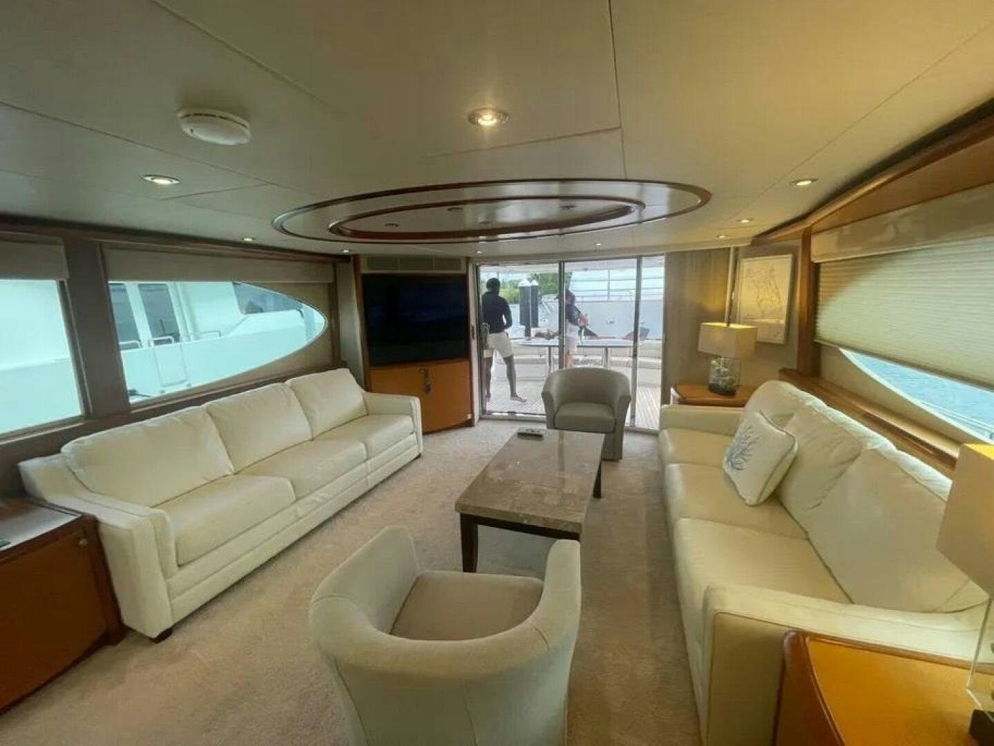 a room with a couch and a table and chairs aboard CERCA TROVA Yacht for Sale