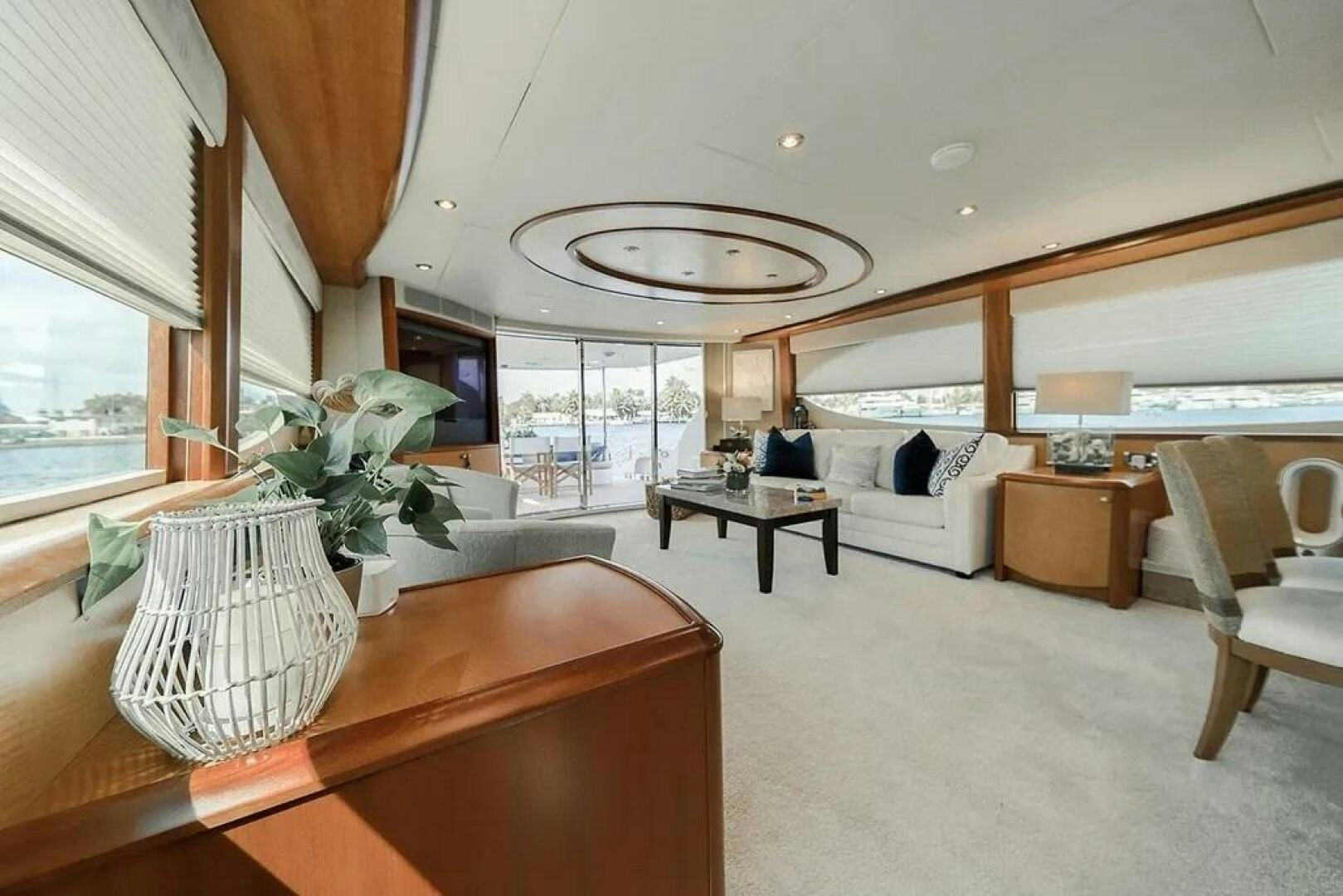 a room with a bed and a table and chairs aboard CERCA TROVA Yacht for Sale