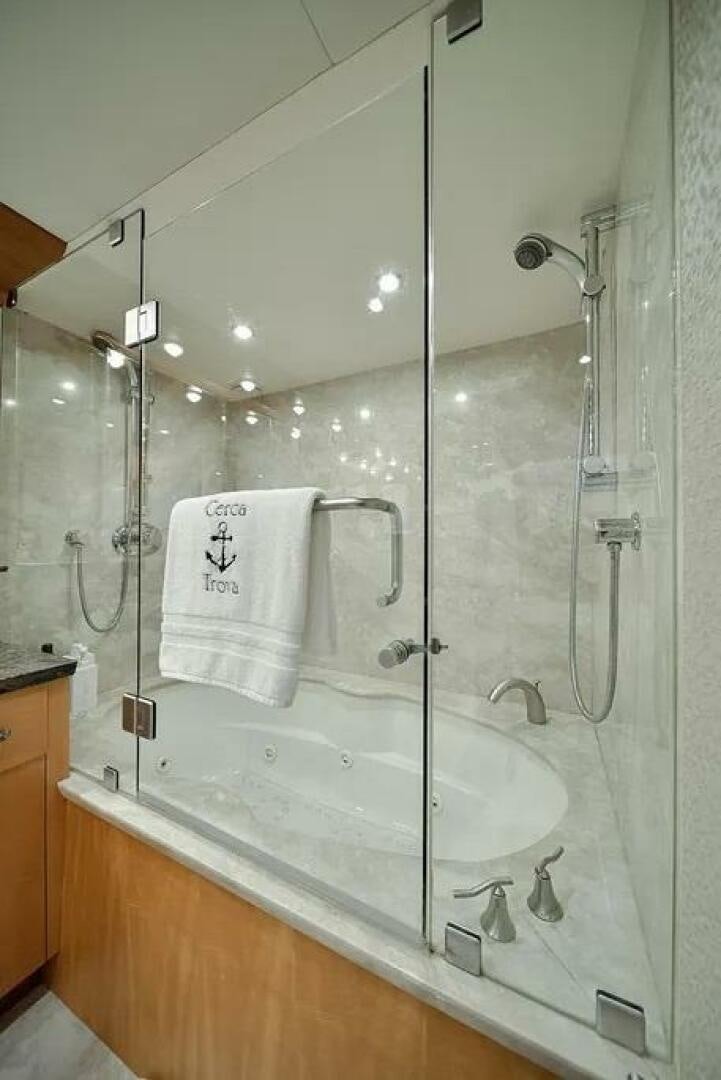 a shower with a glass door aboard CERCA TROVA Yacht for Sale
