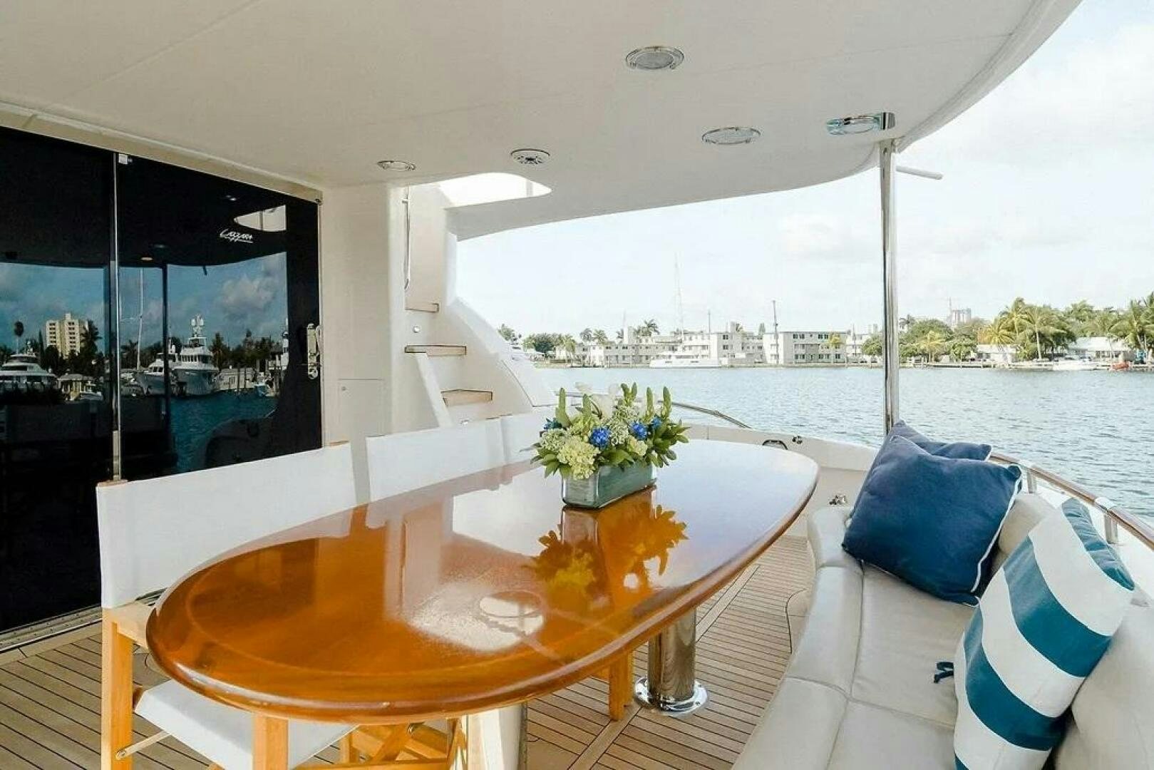 a table with a vase of flowers on it aboard CERCA TROVA Yacht for Sale