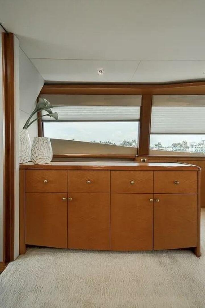 a room with wooden cabinets aboard CERCA TROVA Yacht for Sale