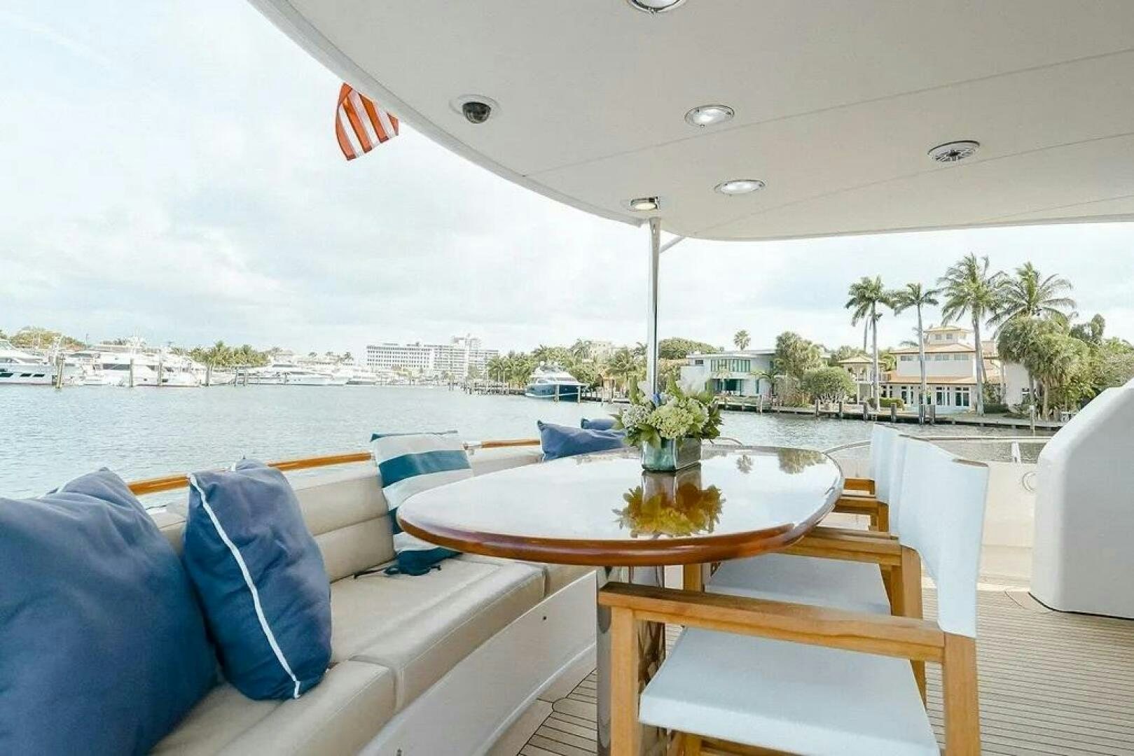 a table and chairs on a deck aboard CERCA TROVA Yacht for Sale