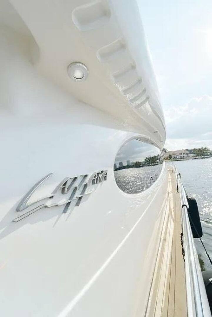 a white boat with a satellite dish on the front aboard CERCA TROVA Yacht for Sale