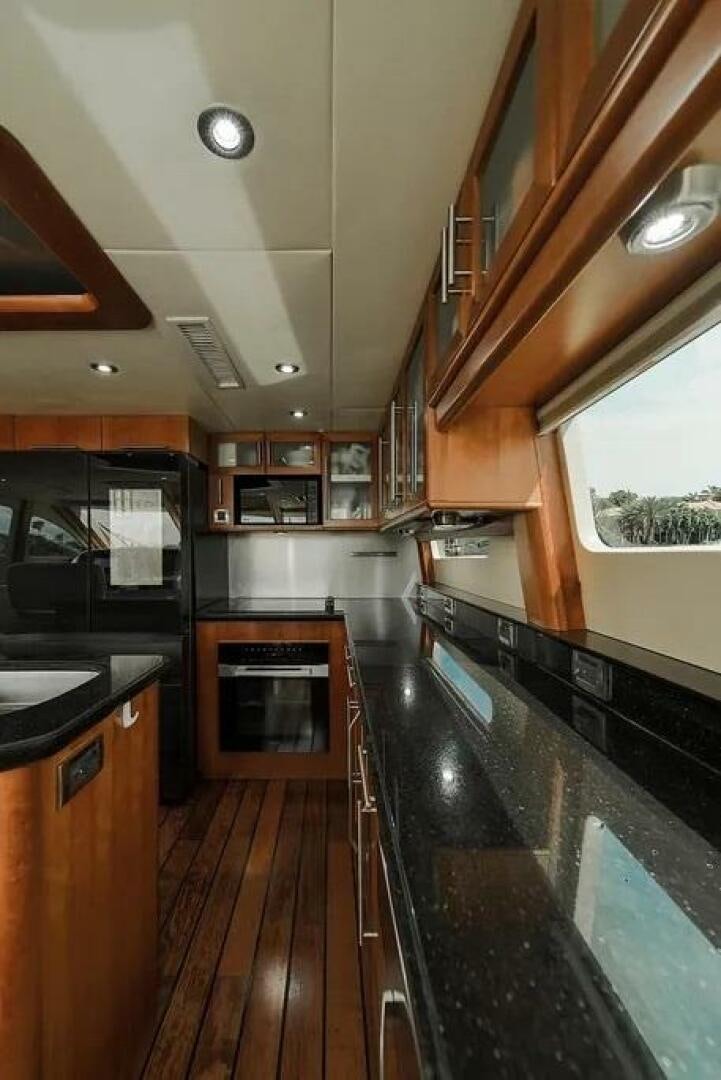 a kitchen with a large island aboard CERCA TROVA Yacht for Sale