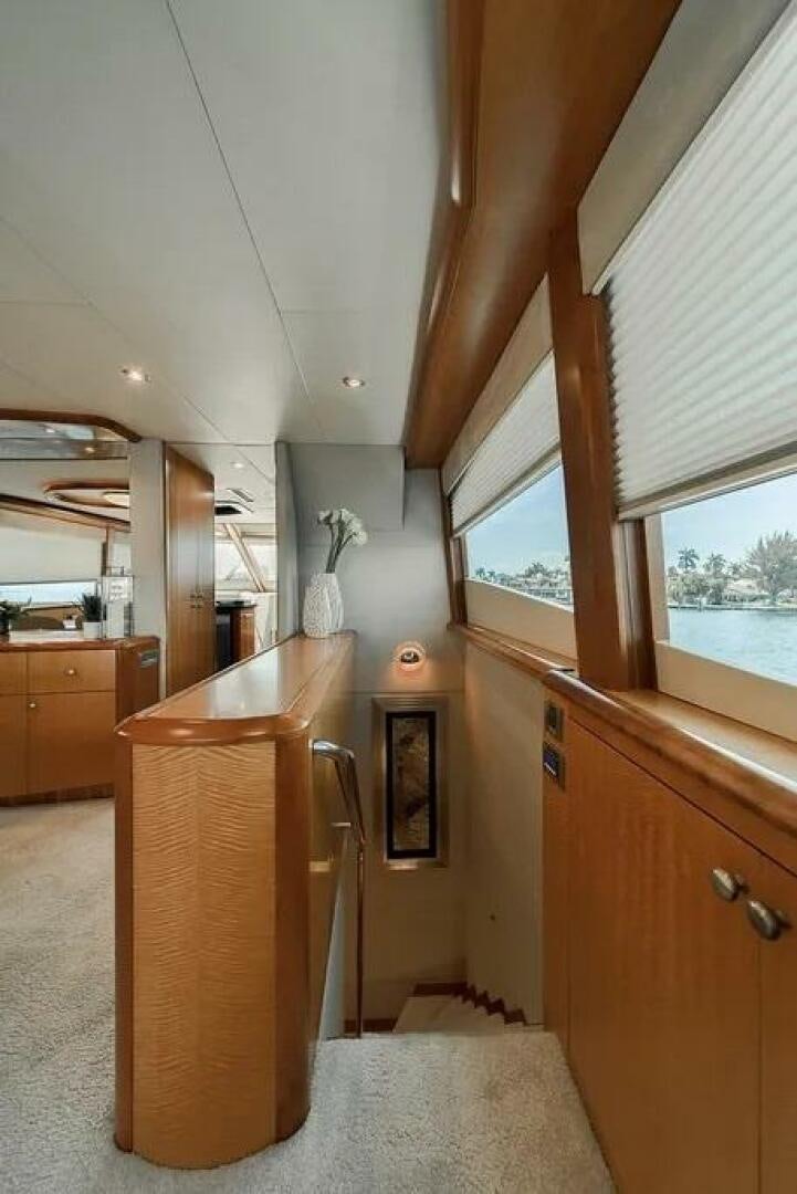 a kitchen with a wood cabinet aboard CERCA TROVA Yacht for Sale