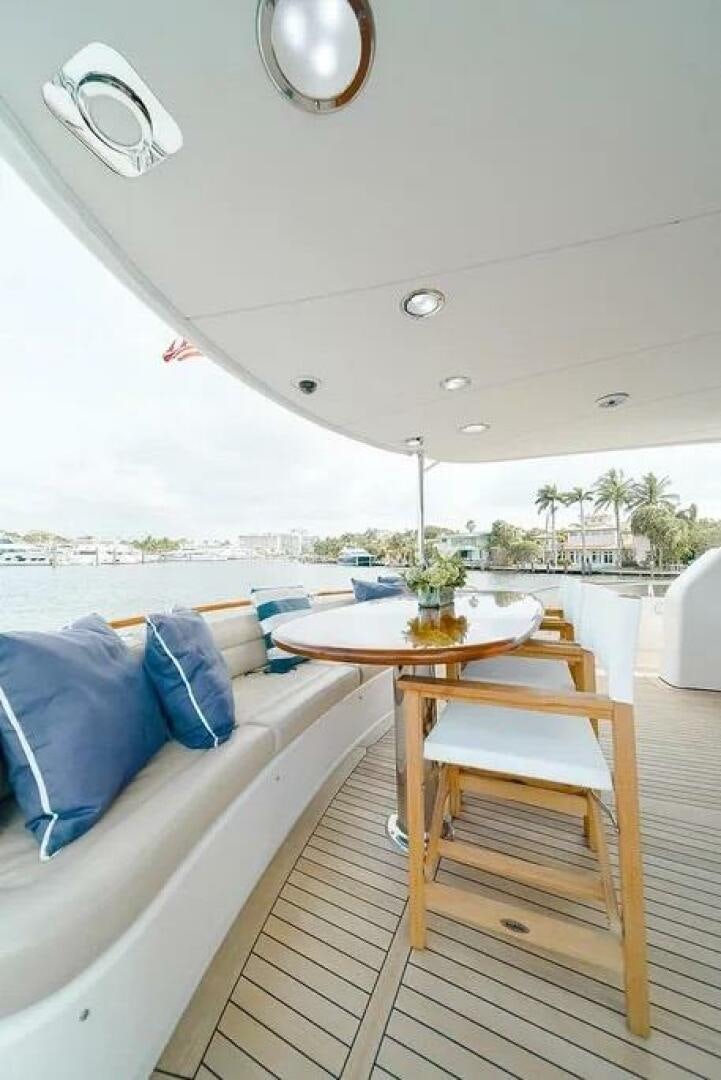 a room with a table and chairs aboard CERCA TROVA Yacht for Sale