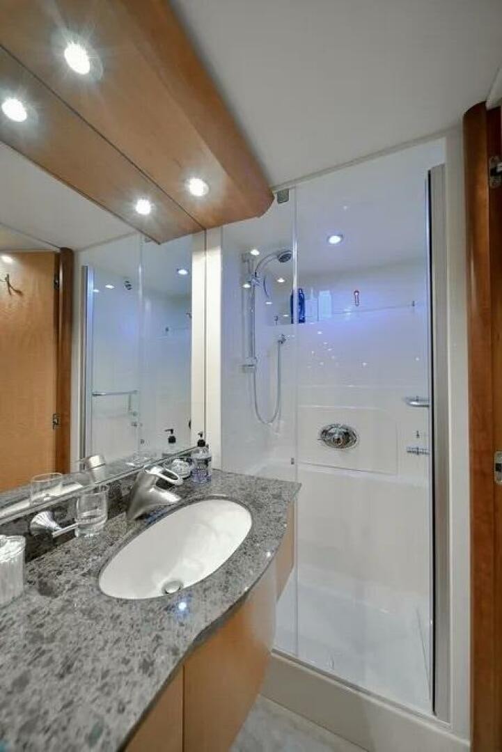 a bathroom with a marble countertop aboard CERCA TROVA Yacht for Sale