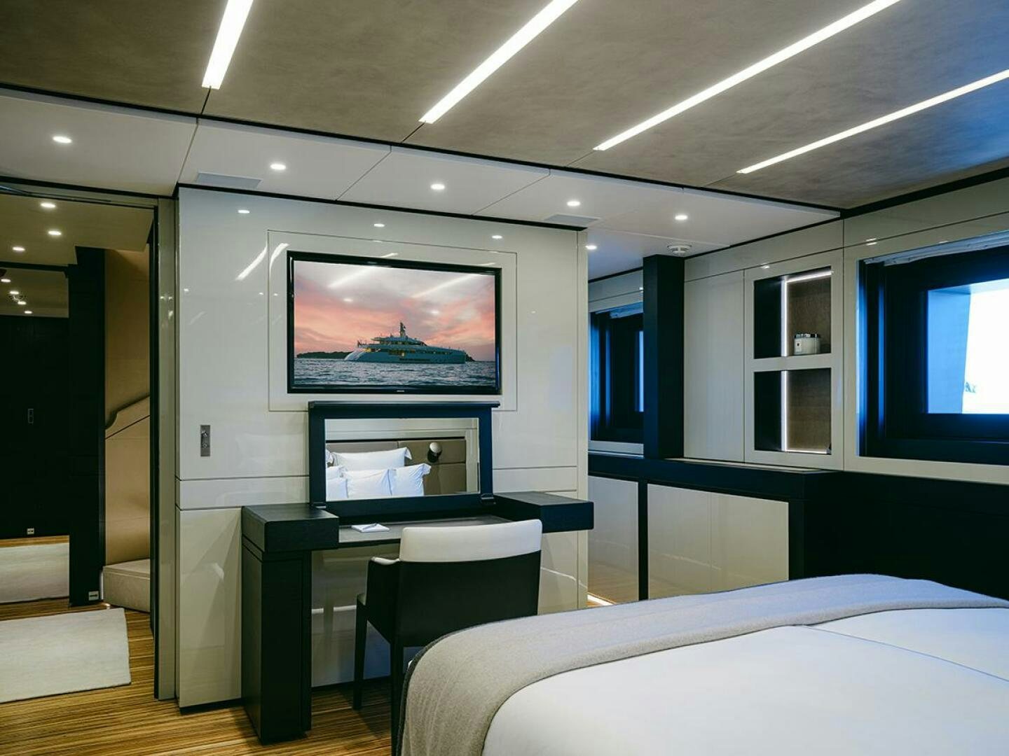 a room with a bed and a tv aboard BARTALI Yacht for Sale