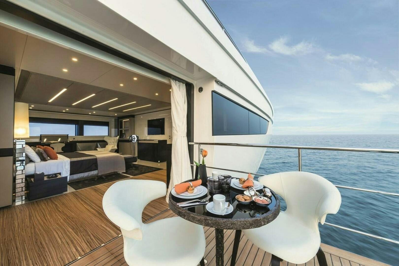a room with a table and chairs aboard BARTALI Yacht for Sale